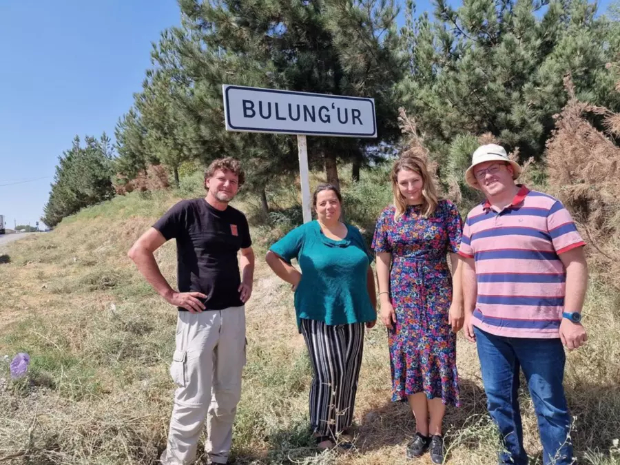 Anna Shternshis and others infront of Bulung'ur sign
