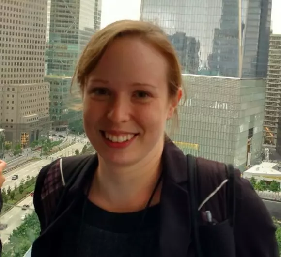 Picture of Dr. Jennifer Ross in front of a window and wearing a black sweater.