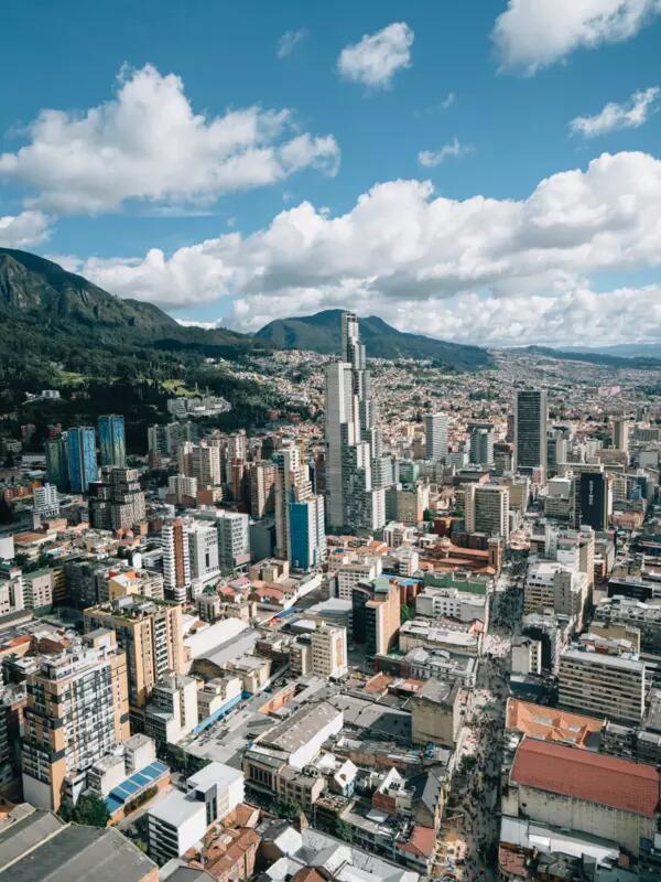 Arial photo of Bogota, Colombia with mountains and blue sky in the background