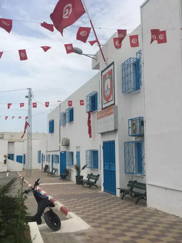 Scene of a white building with blue accents in Tunisia