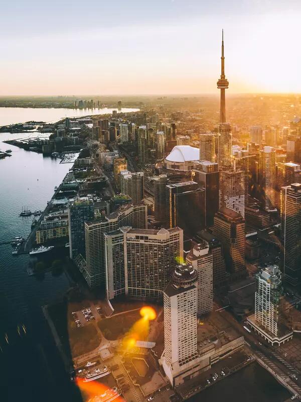 An aerial shot of downtown Toronto and the CN tower in the sunset.