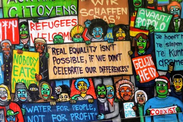 A colourful selection of cartoon drawings with words of support for refugees and minorities