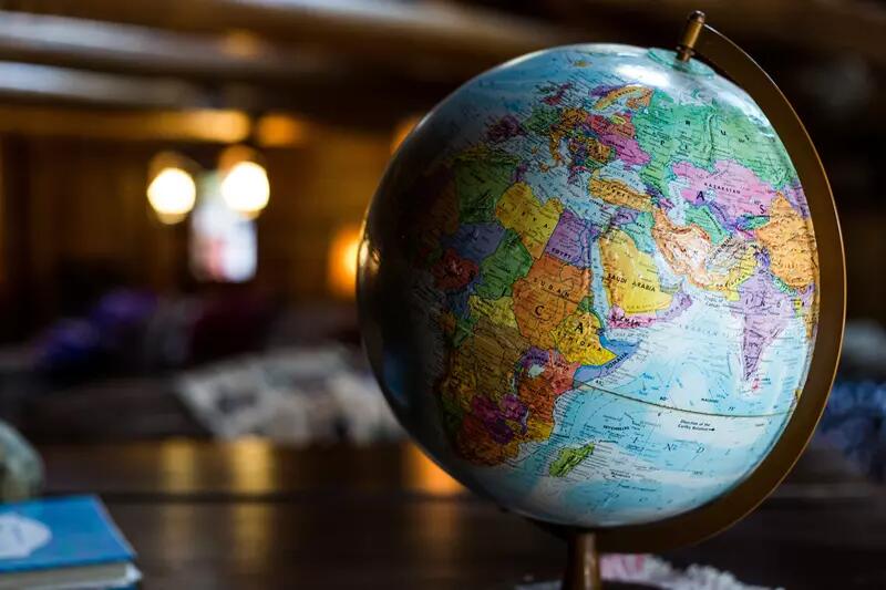 A world globe standing on a desk