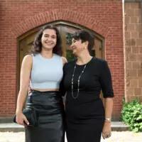 Students take photos with family and friends at the Munk School Convocation