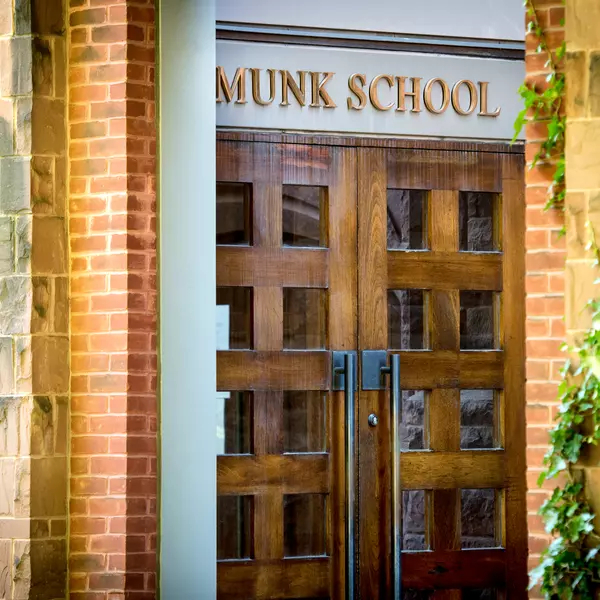 Double doors to 1 Devonshire Place, in wood and glass with Munk School written above the doors